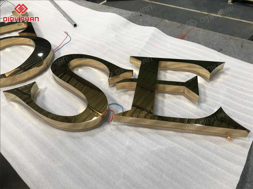 Gia công chữ nổi inox vàng gương BMT