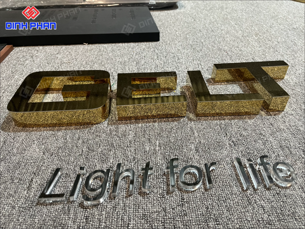 Làm chữ inox vàng gương BMT