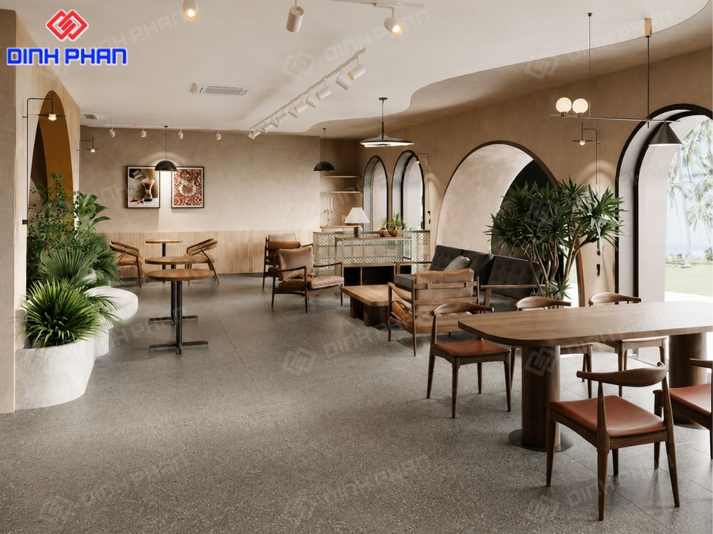 Trang trí quán cafe Đắk Lắk đẹp, ấn tượng và dễ hút khách Không gian quán cafe rộng rãi, tinh tế với vòm cong mềm mại, nội thất gỗ và cây xanh tạo cảm giác thư thái